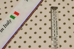 TESSUTO CREPE ELASTICIZZATO FONDO BEIGE CHIARO BOLLO VERDE