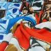TESSUTO CREPE STRETCH FANTASIA GEOMETRICA ROSSO BLU