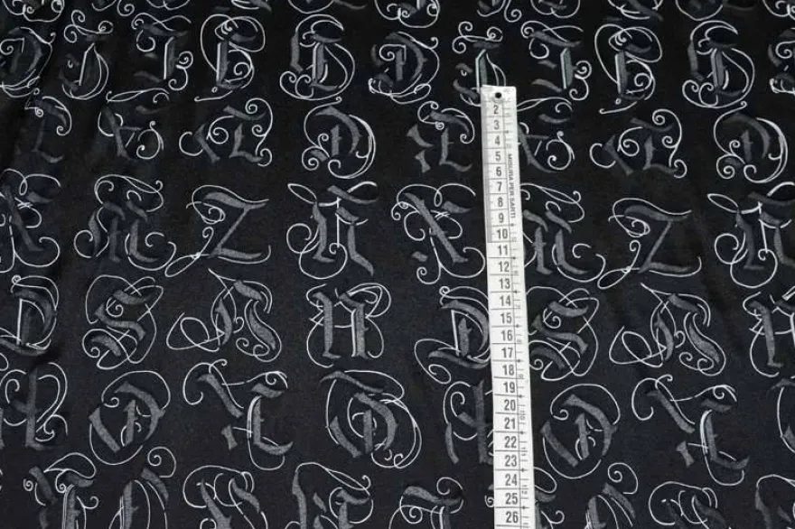 TESSUTO DEVOREH NERO FANTASIA LETTERE