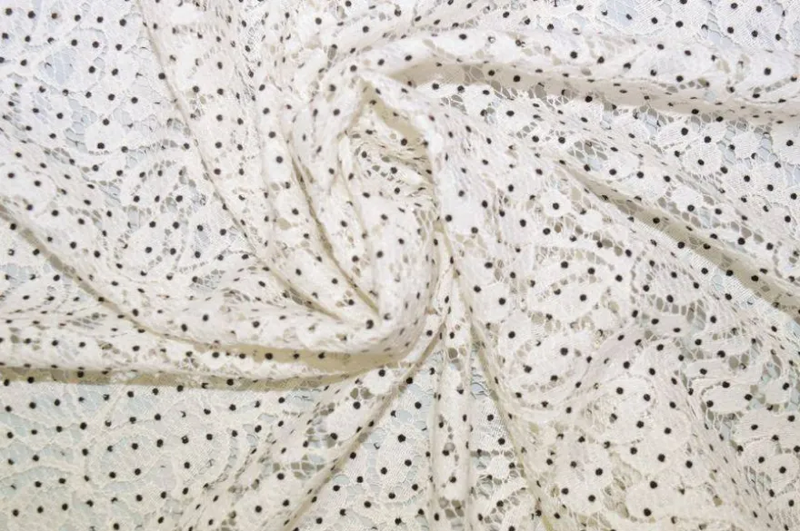 TESSUTO JERSEY DI PIZZO PANNA CON POIS NERI