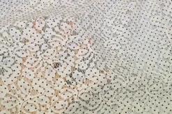 TESSUTO JERSEY DI PIZZO PANNA CON POIS NERI