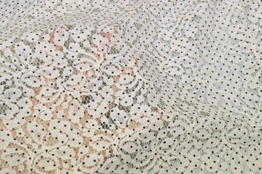 TESSUTO JERSEY DI PIZZO PANNA CON POIS NERI
