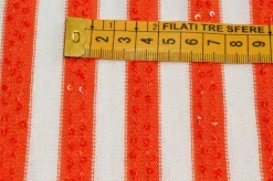 TESSUTO MAGLINA RIGATO CON PAILLETTES APPLICATE ARANCIO