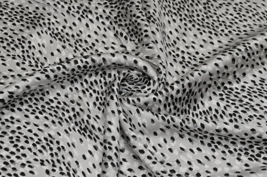TESSUTO RASATELLO PURA VISCOSA MACULATO BIANCO E NERO