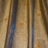 TESSUTO TENDA ORGANZA CANGIANTE ORO BLU CON FIORE RICAMATO