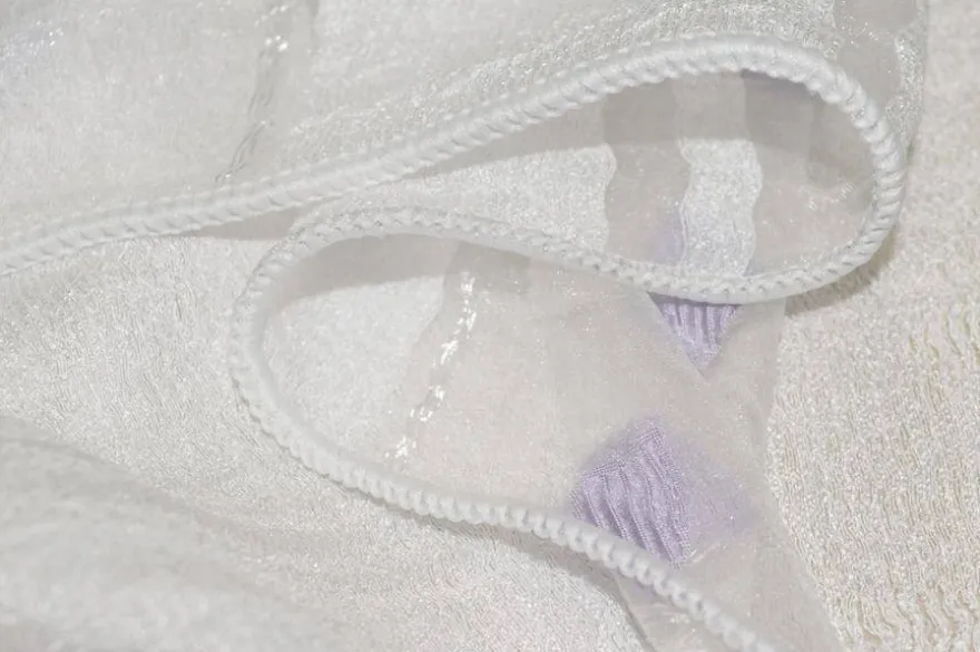 TESSUTO TENDA ORGANZA FASCIATA BIANCA CON INSERTI LILLA