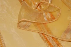TESSUTO TENDA ORGANZA GIALLO/ARANCIO CON FASCE EFFETTO CINIGLIA