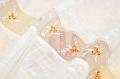 TESSUTO TENDINO CON INCASSO IN ORGANZA FIORELLINO ARANCIO