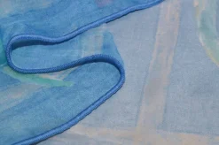 TESSUTO VELO STAMPA FIORE FONDO AZZURRO